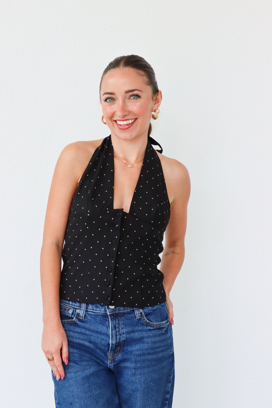 girl wearing black tuxedo style top