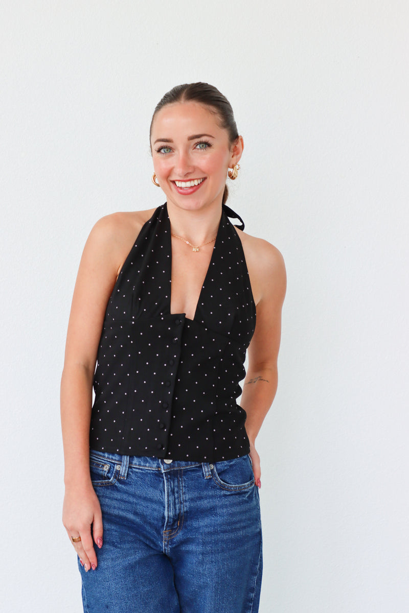 girl wearing black tuxedo style top