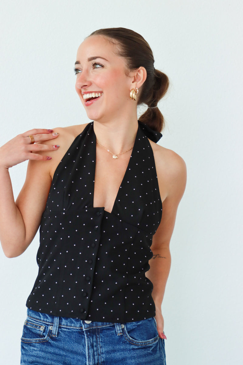 girl wearing black tuxedo style top