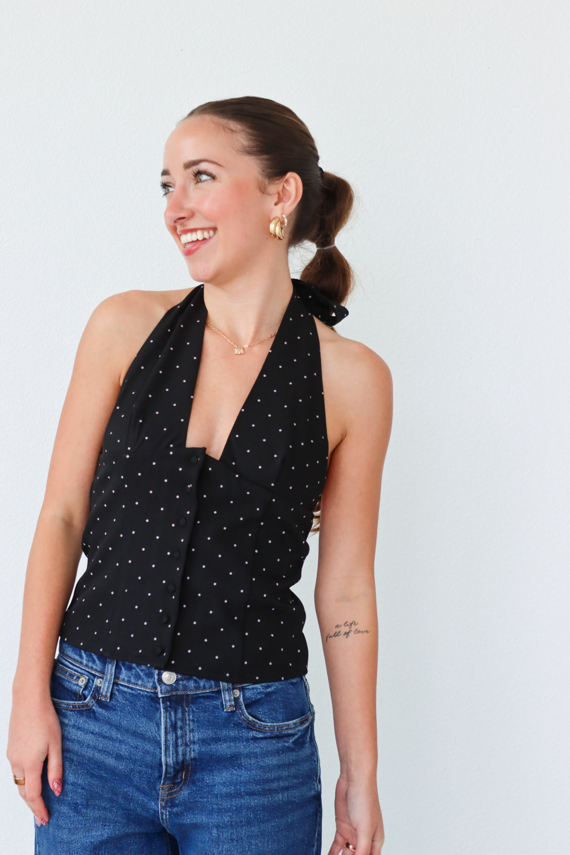 girl wearing black tuxedo style top