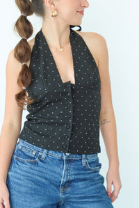 girl wearing black tuxedo style top