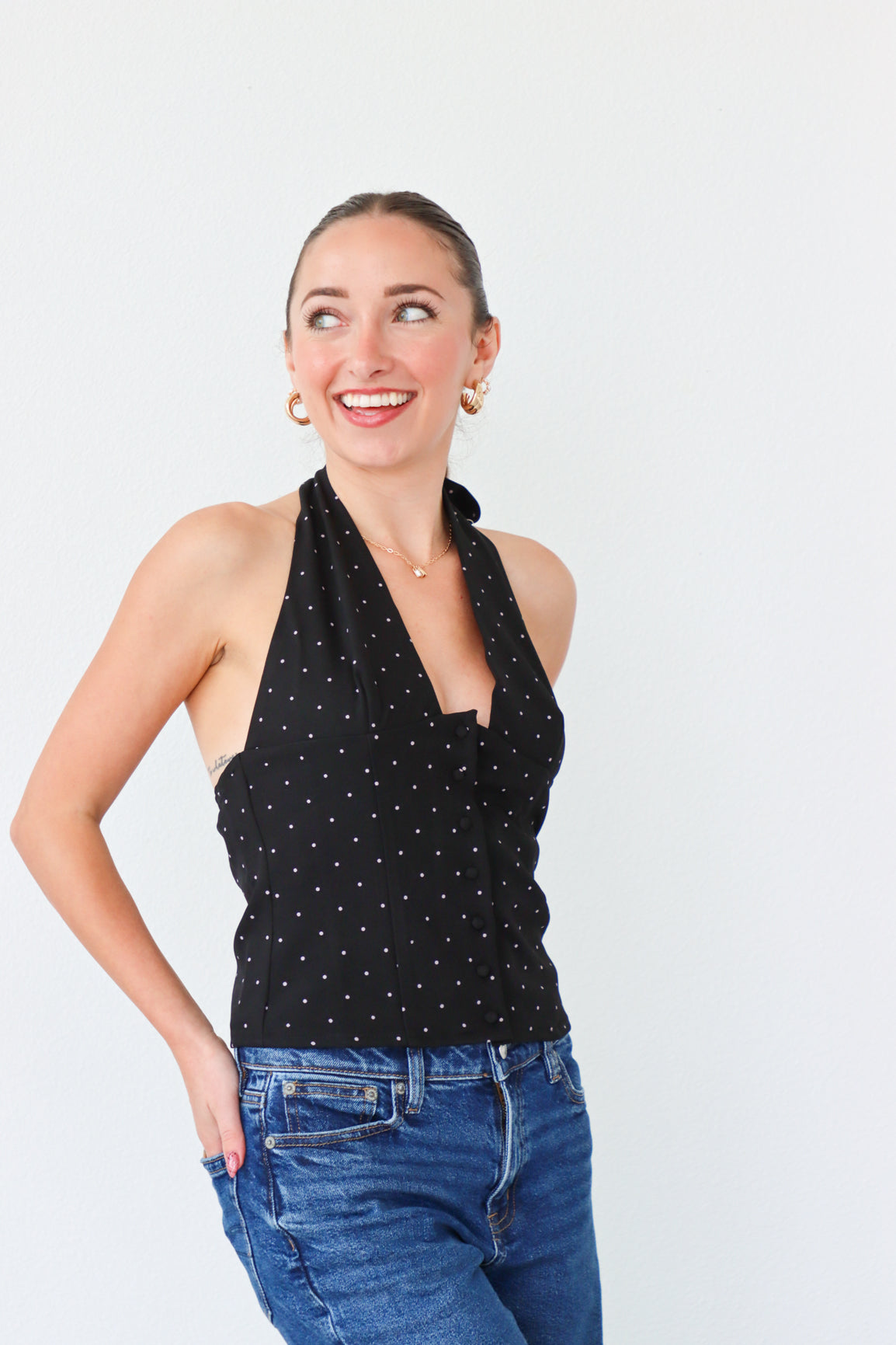 girl wearing black tuxedo style top