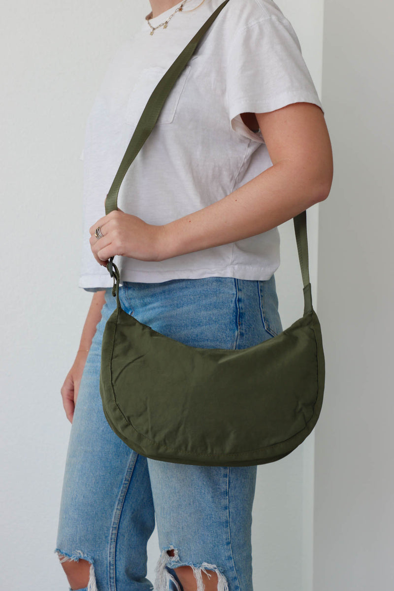 girl carrying green nylon bag