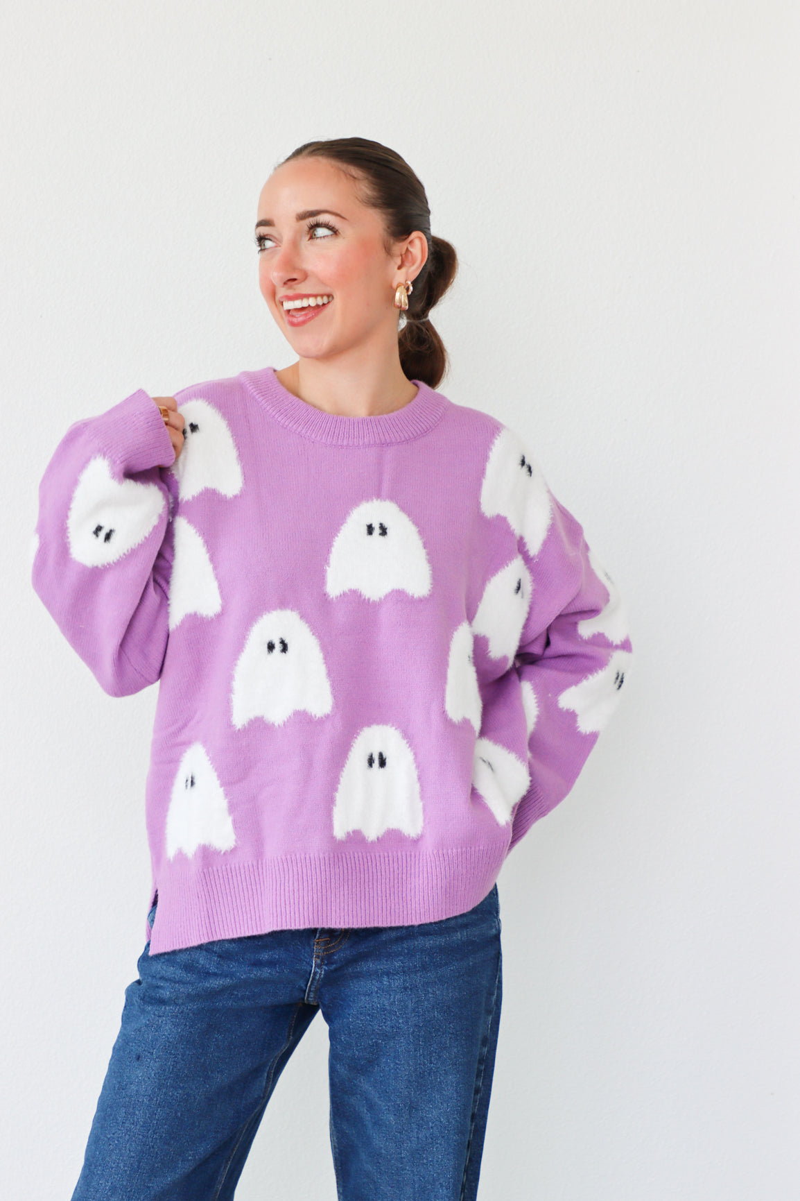 girl wearing purple ghost sweater
