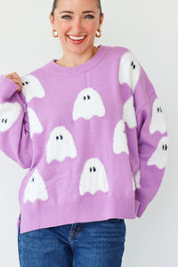 girl wearing purple ghost sweater