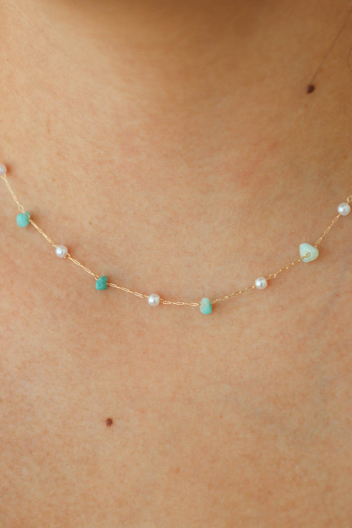 gold dainty necklace with blue stone beads