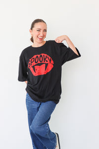 girl wearing "spooky" black graphic tee
