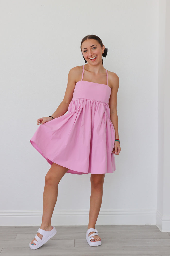 girl wearing bright pink bubble dress