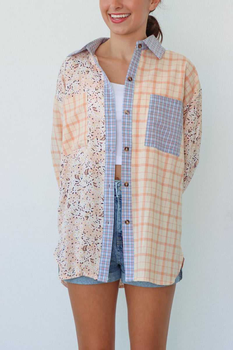 girl wearing pastel multicolored patterned button up top