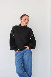 girl wearing black turtleneck sweater
