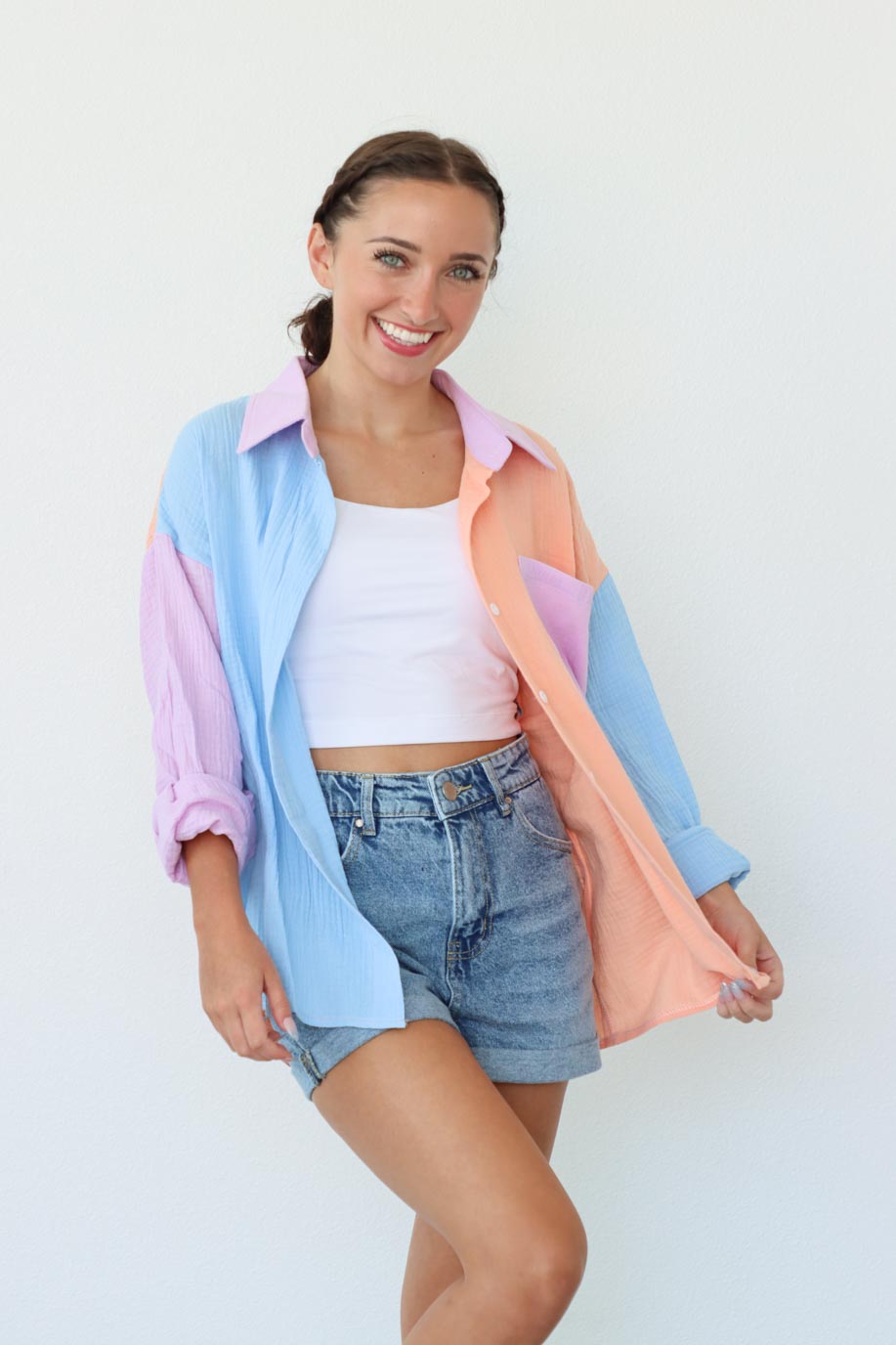 girl wearing pastel multicolored button down top