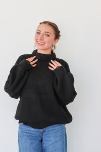 girl wearing black turtleneck sweater