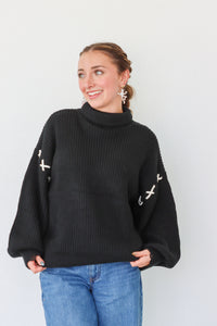 girl wearing black turtleneck sweater