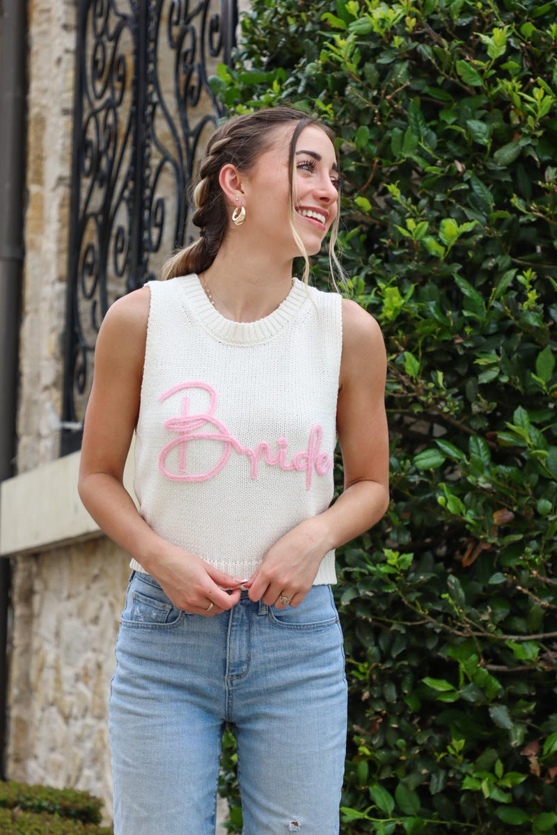 girl wearing white knit tank top with pink "bride" lettering