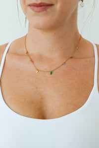 gold necklace with rainbow gem charms