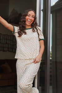 girl wearing cream floral pajamas