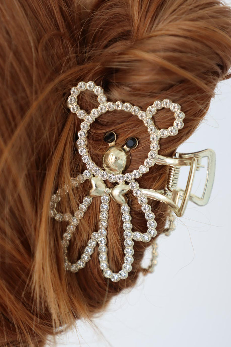 girl wearing gold teddy bear rhinestone claw clip in her hair