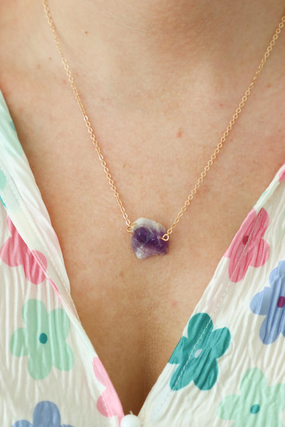 girl wearing purple stone necklace