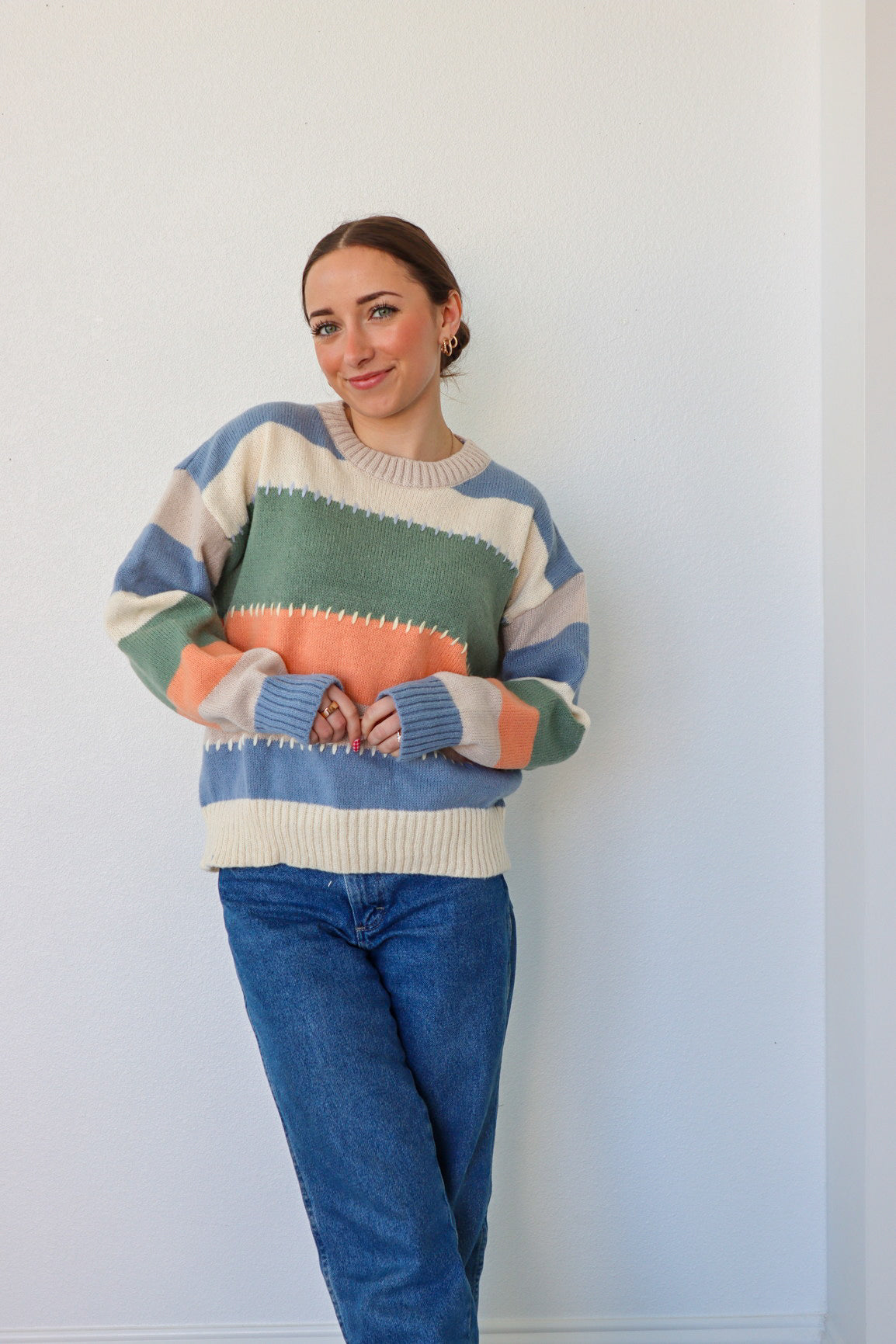 girl wearing multicolor knit sweater