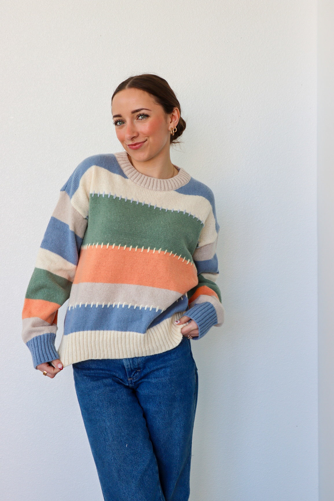 girl wearing multicolor knit sweater