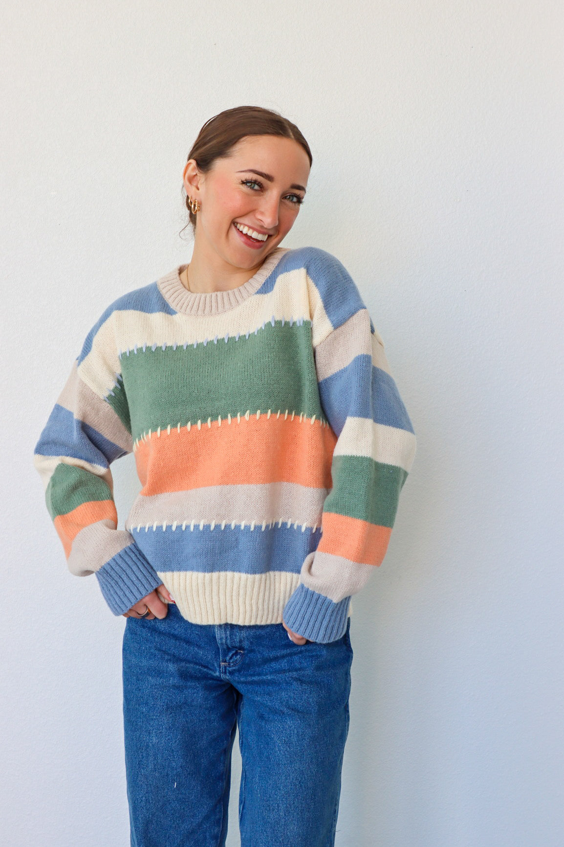 girl wearing multicolor knit sweater