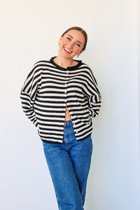 girl wearing black and white striped cardigan