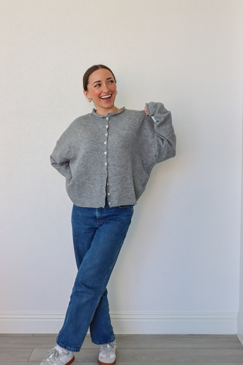 girl wearing gray cardigan