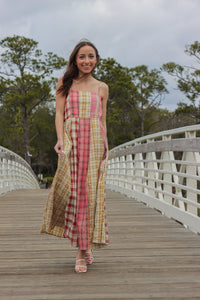 girl wearing pink and yellow plaid maxi dress