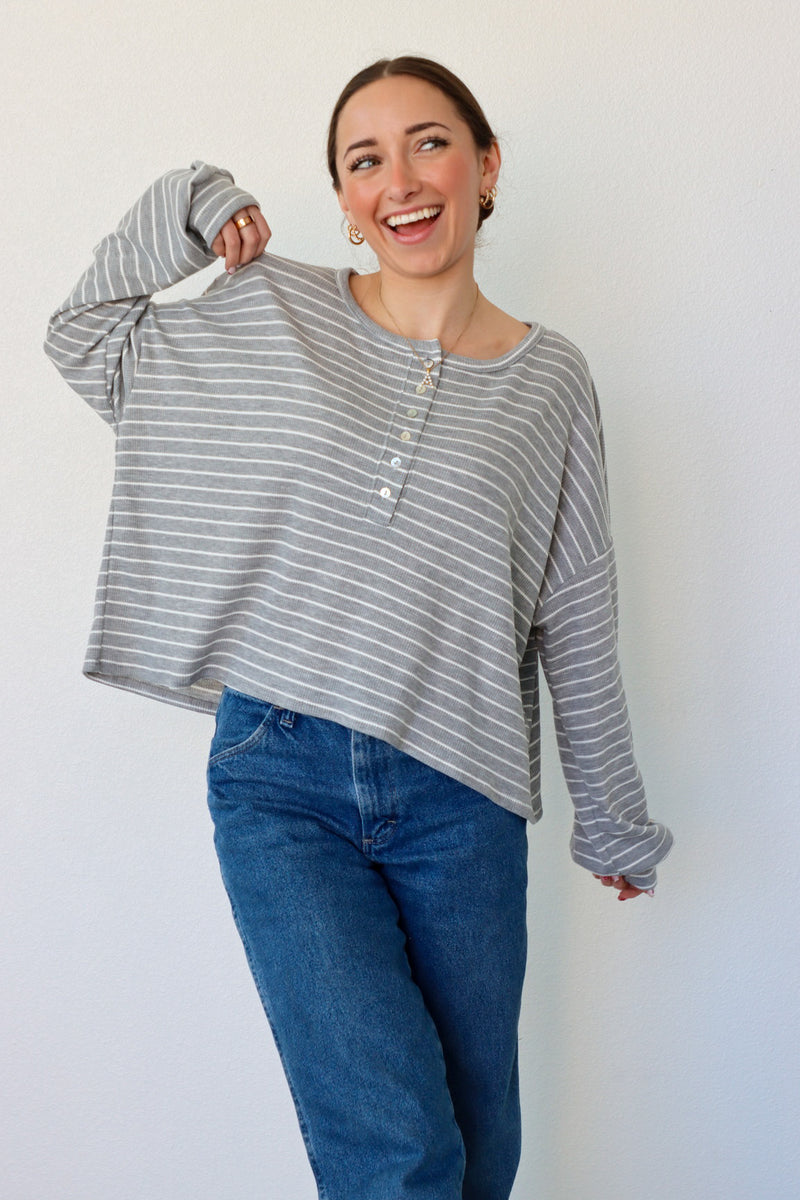 girl wearing gray and white striped top