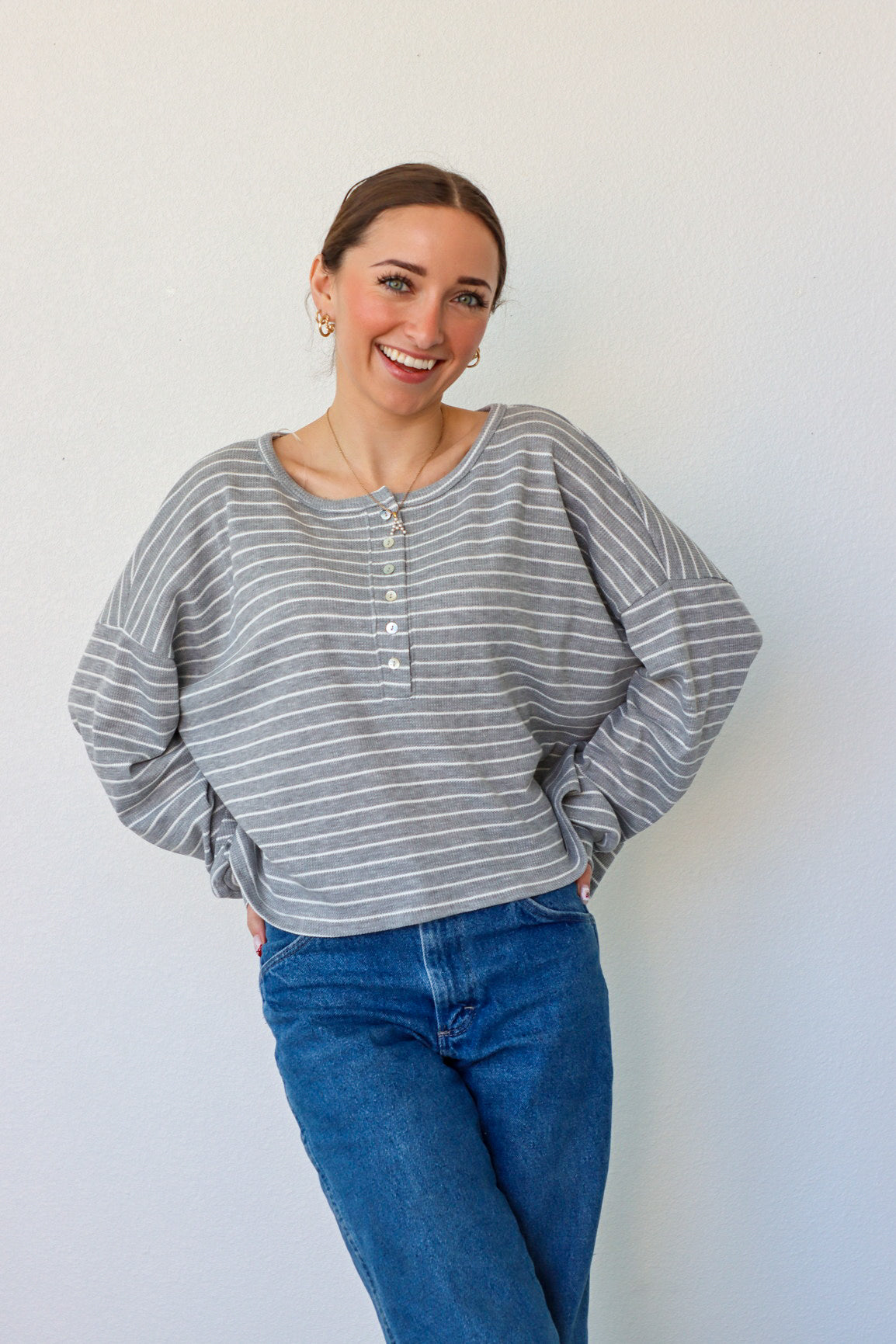 girl wearing gray and white striped top