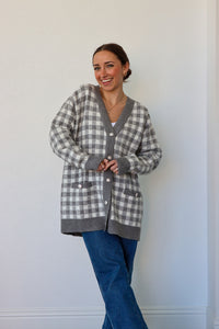 girl wearing gray houndstooth cardigan