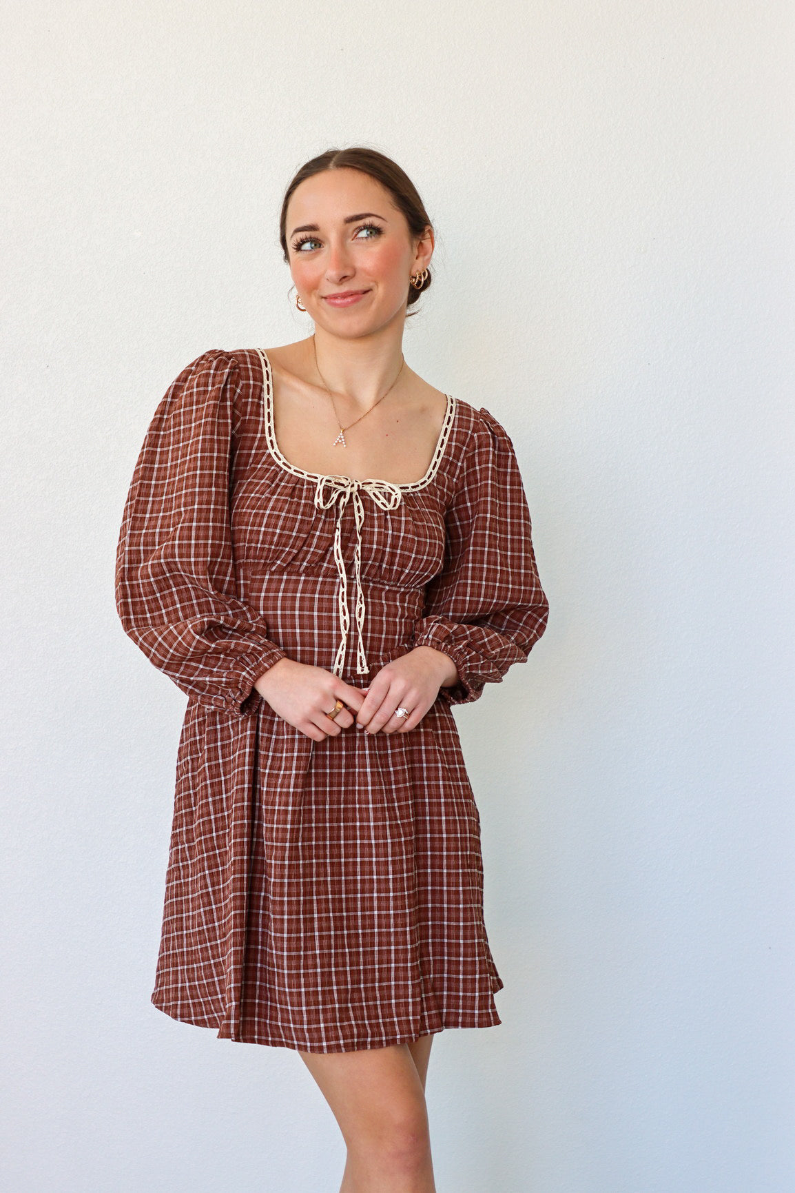 girl wearing brown peasant style dress