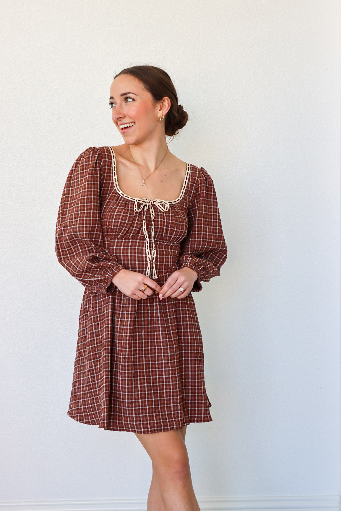 girl wearing brown peasant style dress