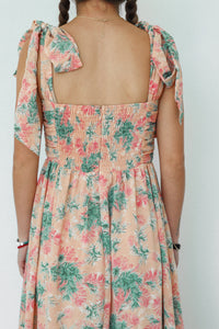 zipper back detailing on peach long dress with palm pattern