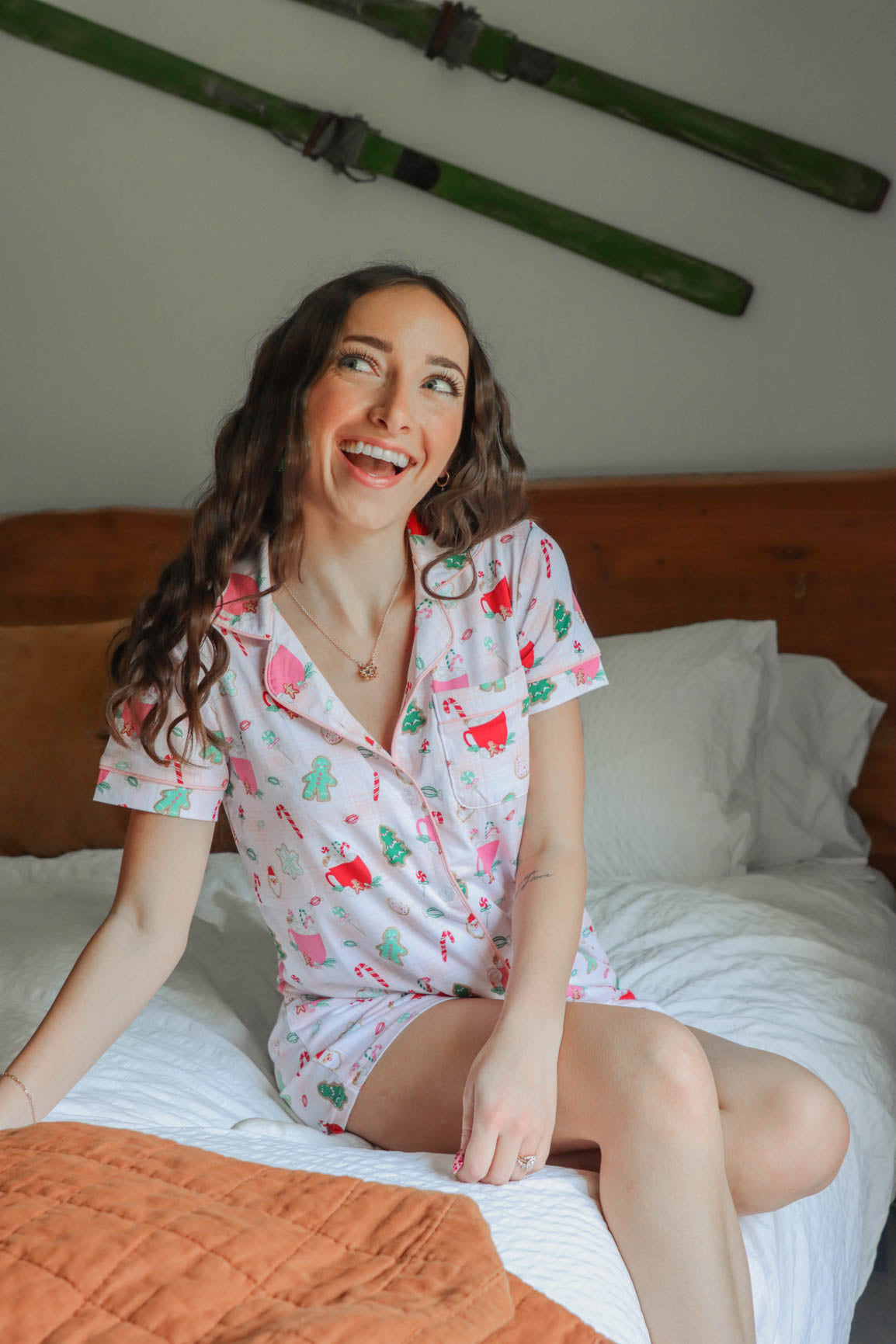 girl wearing light pink santa pajama set