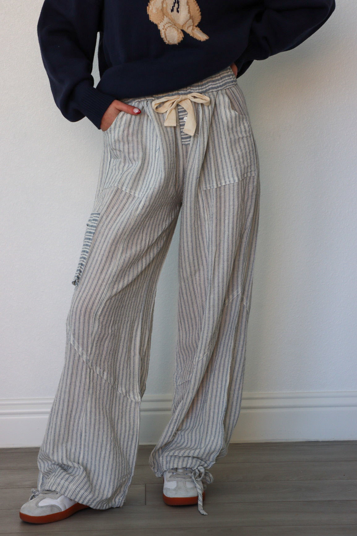 girl wearing light blue beach pants