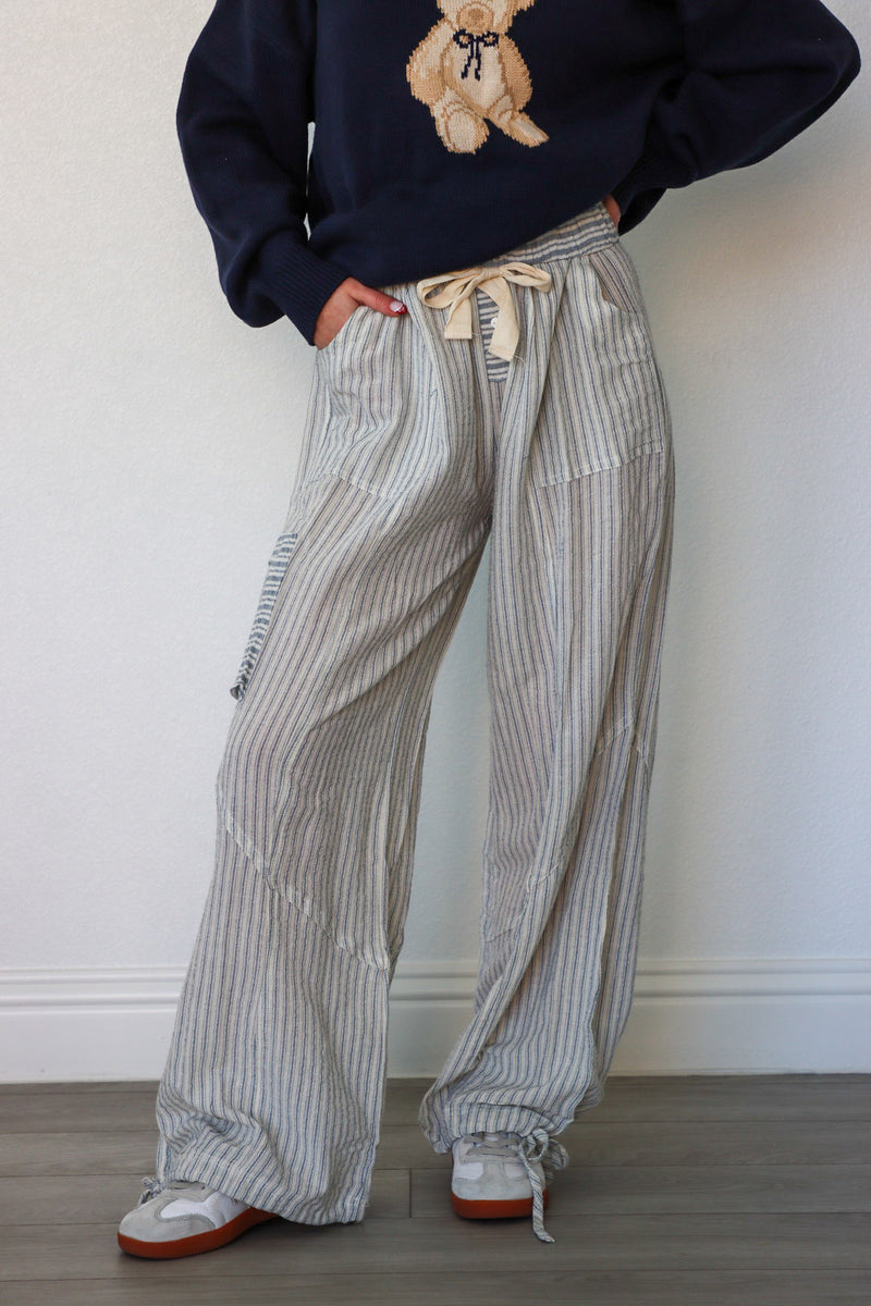 girl wearing light blue beach pants