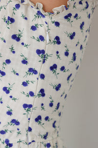 side zipper on white long peasant dress with blue floral pattern