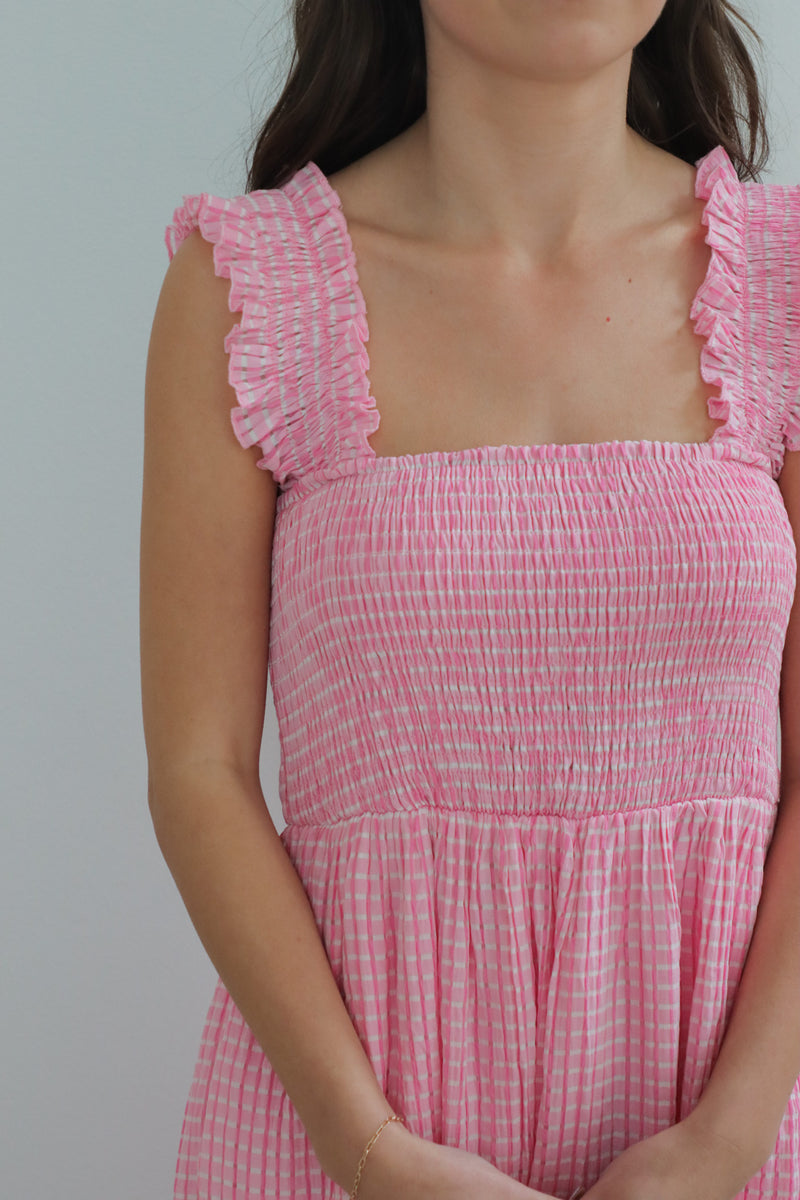 girl wearing pink gingham midi dress