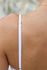 adjustable straps on white cropped tank top
