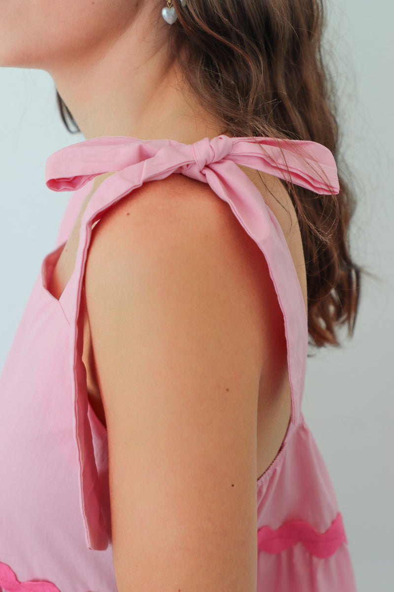 girl wearing pink short dress