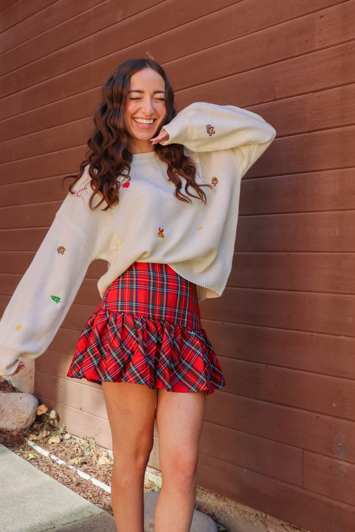 girl wearing red plaid skirt