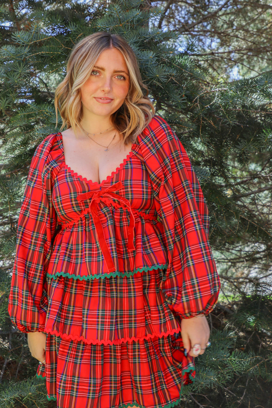 girl wearing red plaid holiday dress