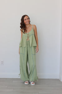 girl wearing sage green linen matching set