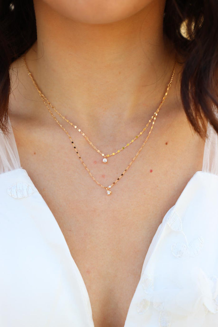 girl wearing gold chain necklace