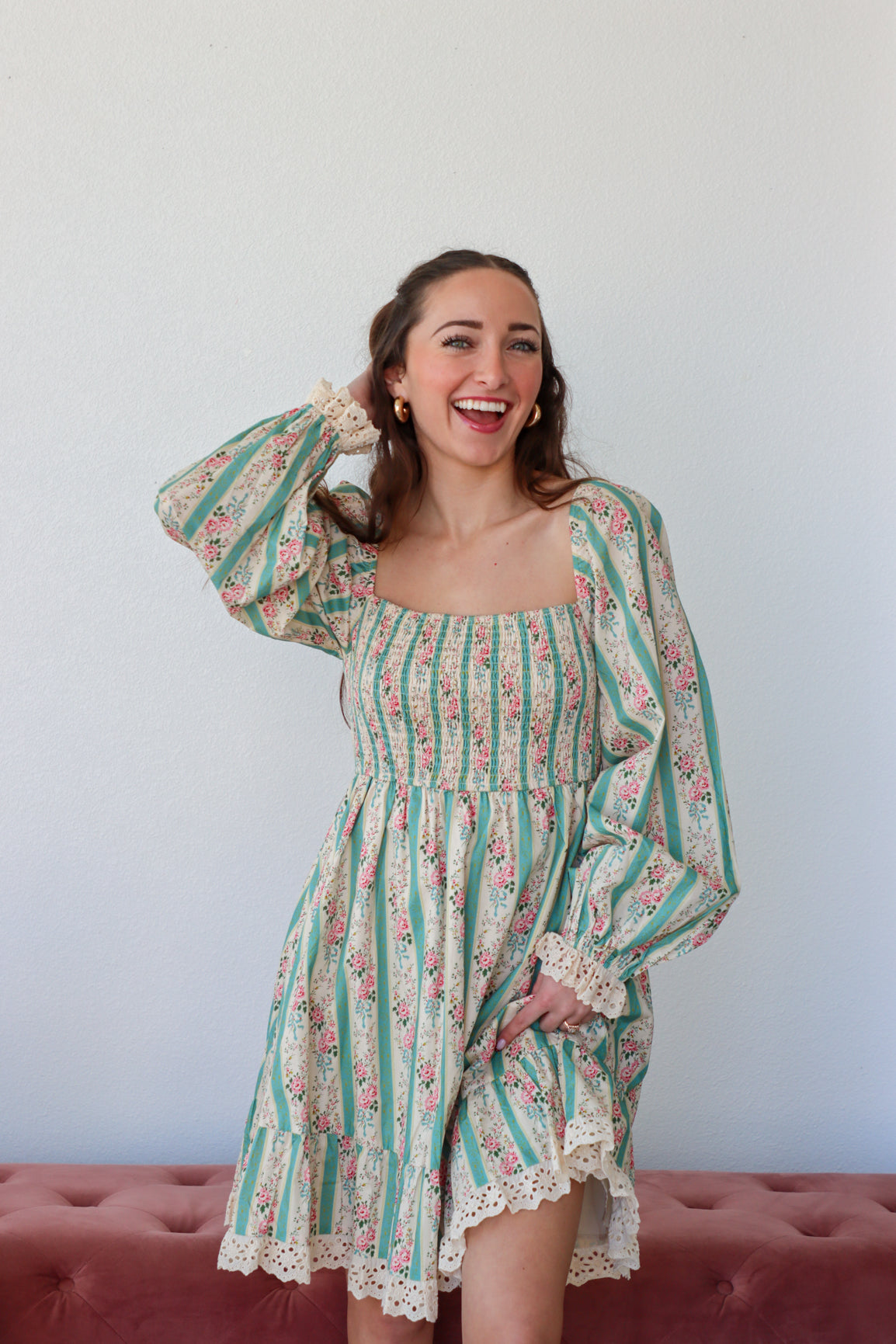 Floral and striped dress with a plain background