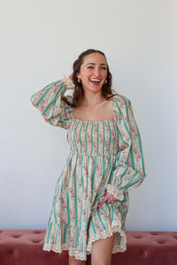 Floral and striped dress with a plain background