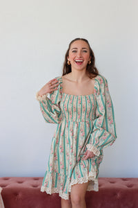 Floral and striped dress with a plain background