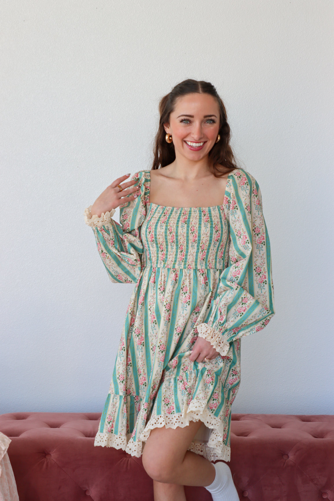 Floral and striped dress with a plain background