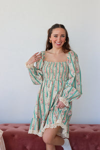 Floral and striped dress with a plain background